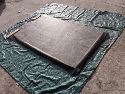Landscape fabric as backer